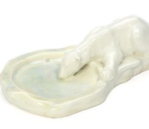 Porcelain dish in the shape of a drinking white bear by Royal Copenhagen.