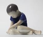 Статуэтка The boy sitting with his…